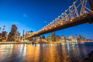 Illuminated Queensborough bridge at night, New York City