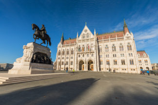 Statue of Count Gyula Andrassy, Parliament building behind,  Budapest, Hungary