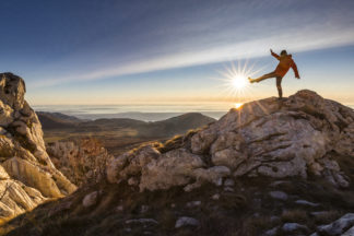 Hiker on mountain peak Velebit in Croatia