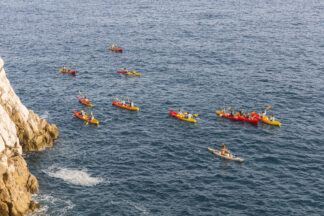 Kayaking under walls of Dubrovnik old town