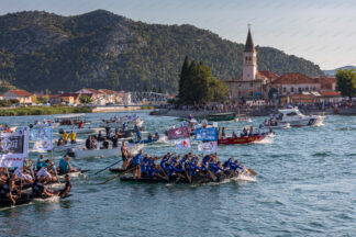 Traditional Ladja competitions 2023, "26th Ladja marathon"; Opuzen town in the back