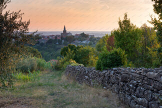 Groznjan old town on the hill at sunset with