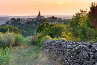 Groznjan old town on the hill at sunset