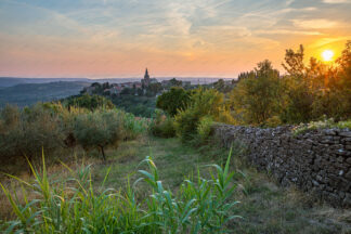 Groznjan old town on the hill at sunset