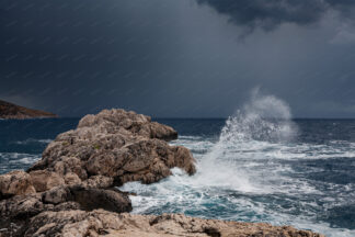 Sea storm, a big waves splashing Zarace rock on island Hvar