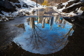 Water reflection of Manhattan buildings in Central park, New York