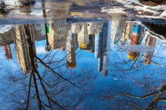 Water reflection of Manhattan buildings in Central park, New York