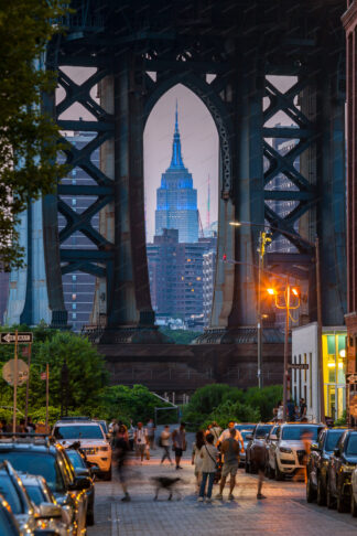 Empire State Building view trougr Brooklyn Bridge in New York