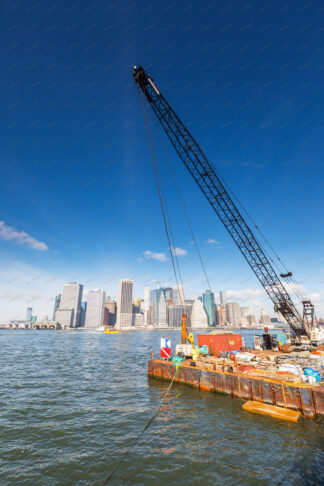 Floating wotk platform on East river with Manhattan behind in New York City