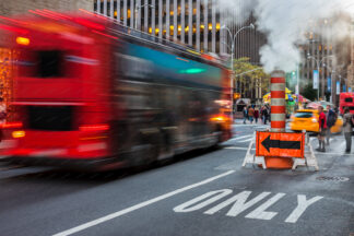 Bus in speed with steam pipe (49th street), New York City