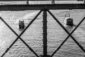 Composition, view to the sailing ships trough the Brooklyn Bridge in New York City