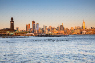 Clock tower in Hoboken, New Jersey. New York in a distance