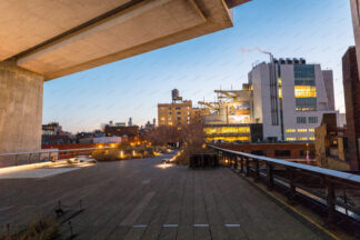 High Line Park walkway at night, building of Whitney Museum of American Art on the right, New York City