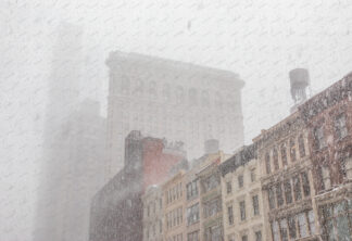 Flatiron building at heawy snow storm in New York City