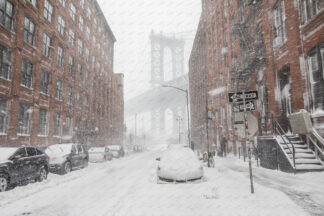 Heavy snowfall in Washington street a view to Manhattan bridge; Dumbo, New York City,