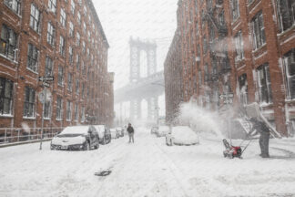 Heavy snowfall in Washington street a view to Manhattan bridge; Dumbo, New York City