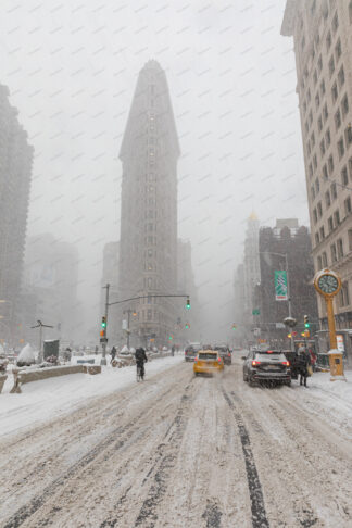 Flatiron building in 5ave at snow storm in New York City