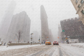 Flatiron building at heawy snow storm in New York City