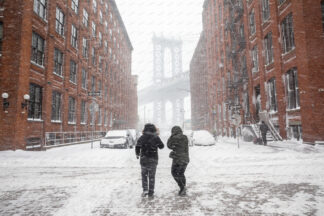 Heavy snowfall in Washington street a view to Manhattan bridge; Dumbo, New York City