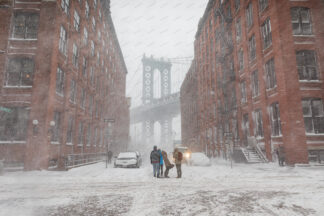 Heavy snowfall in Washington street a view to Manhattan bridge; Dumbo, New York City