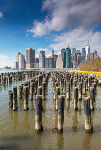 New York Downtown over wooden pillars on Brooklyn site