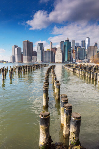 New York Downtown over wooden pillars on Brooklyn site