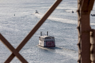 View to the Sailing ship trough the Brooklyn Bridge in New York City