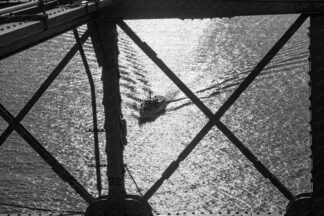 A view to the Sailing ship trough the Brooklyn Bridge in New York City