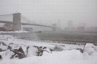 Snow Brooklyn Bridge and New York City Downtown