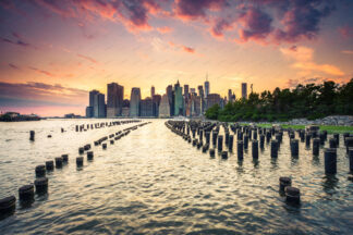 New York Downtown at sunset over wooden pillars