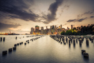 New York Downtown at sunset over wooden pillars