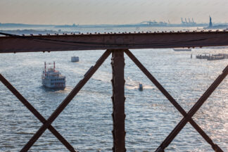 View to the Sailing ship trough the Brooklyn Bridge in New York City