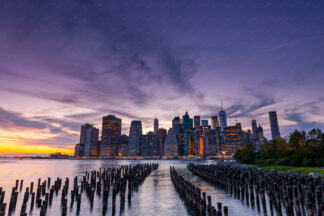 Downtown sunset over wooden pillars in New York City