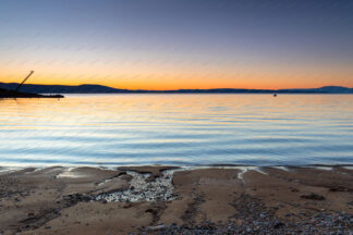 Beach sunset, Krk island in front, Croatia