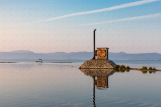 Mural of cat head on the old signal shelter in Neretva Delta