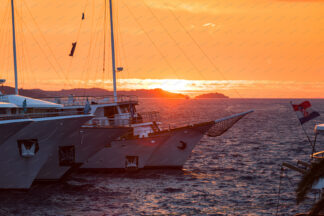 Yacht docking at sunset in Korcula harbor, Croatia